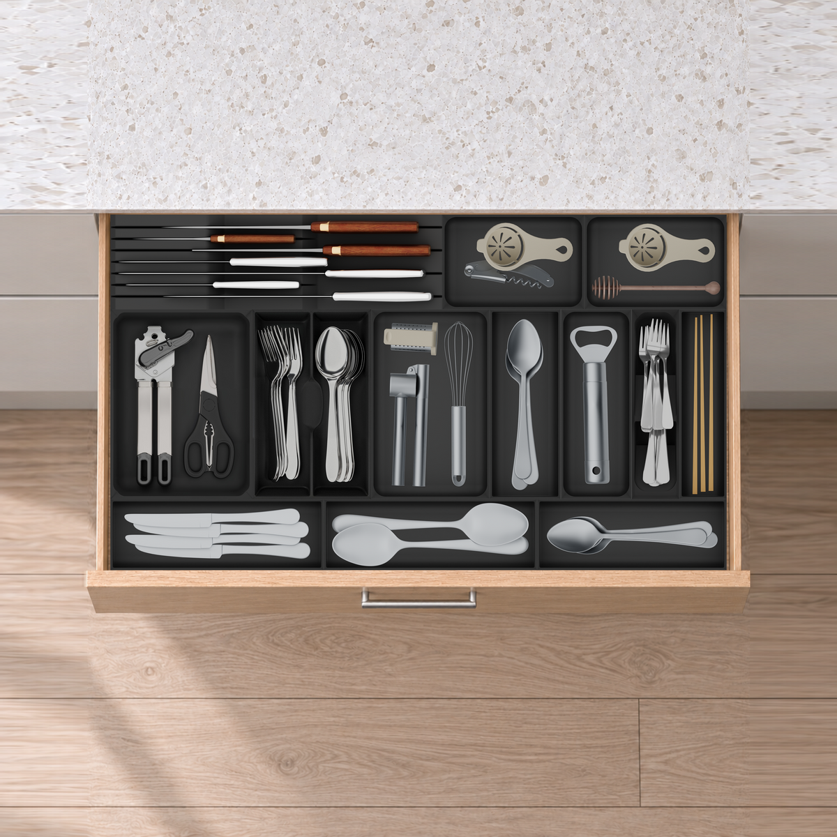 Wide Cutlery, Chef Knives & Kitchen Tools Drawer Organiser Set in Charcoal Black, fitted in an oak drawer under neutral white light. Nominal layout 767 × 442.5 mm. Accessories shown are not included.