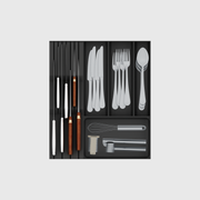 Charcoal Black five-module cutlery and chef knife drawer set, shown with illustrative utensils