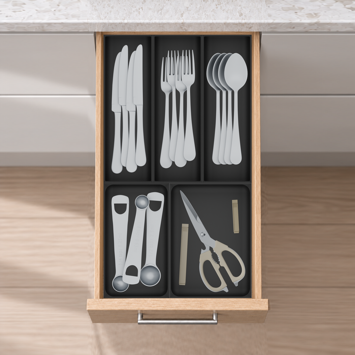 Narrow Cutlery & Kitchen Tools Drawer Organiser Set in Charcoal Black, fitted in an oak drawer under neutral white light. Nominal layout 265.5 × 472 mm. Accessories shown are not included.
