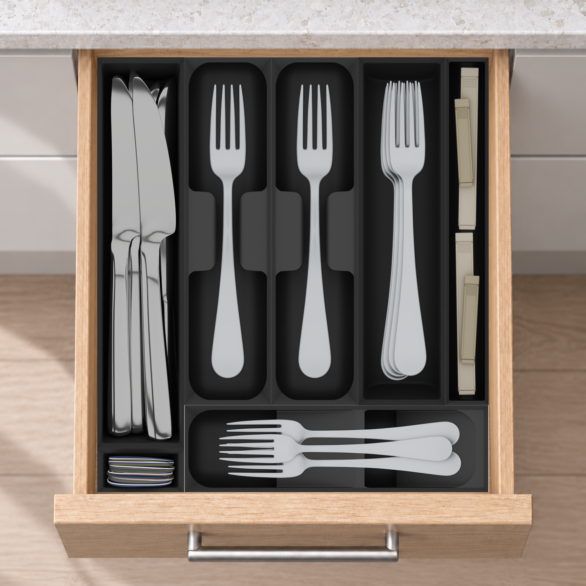 Compact Cutlery Drawer Organiser Set – 295 × 265.5 mm in Charcoal Black, fitted wall-to-wall in an illustrative natural oak drawer under neutral white light. Accessories shown for illustration.