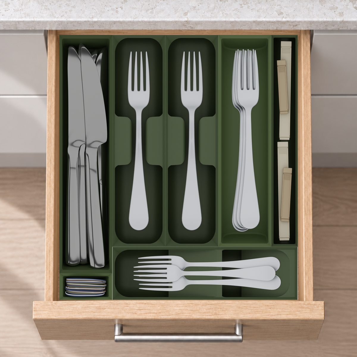 Compact Cutlery Drawer Organiser Set – 295 × 265.5 mm in Olive Green, fitted wall-to-wall in an illustrative natural oak drawer under neutral white light. Accessories shown for illustration.