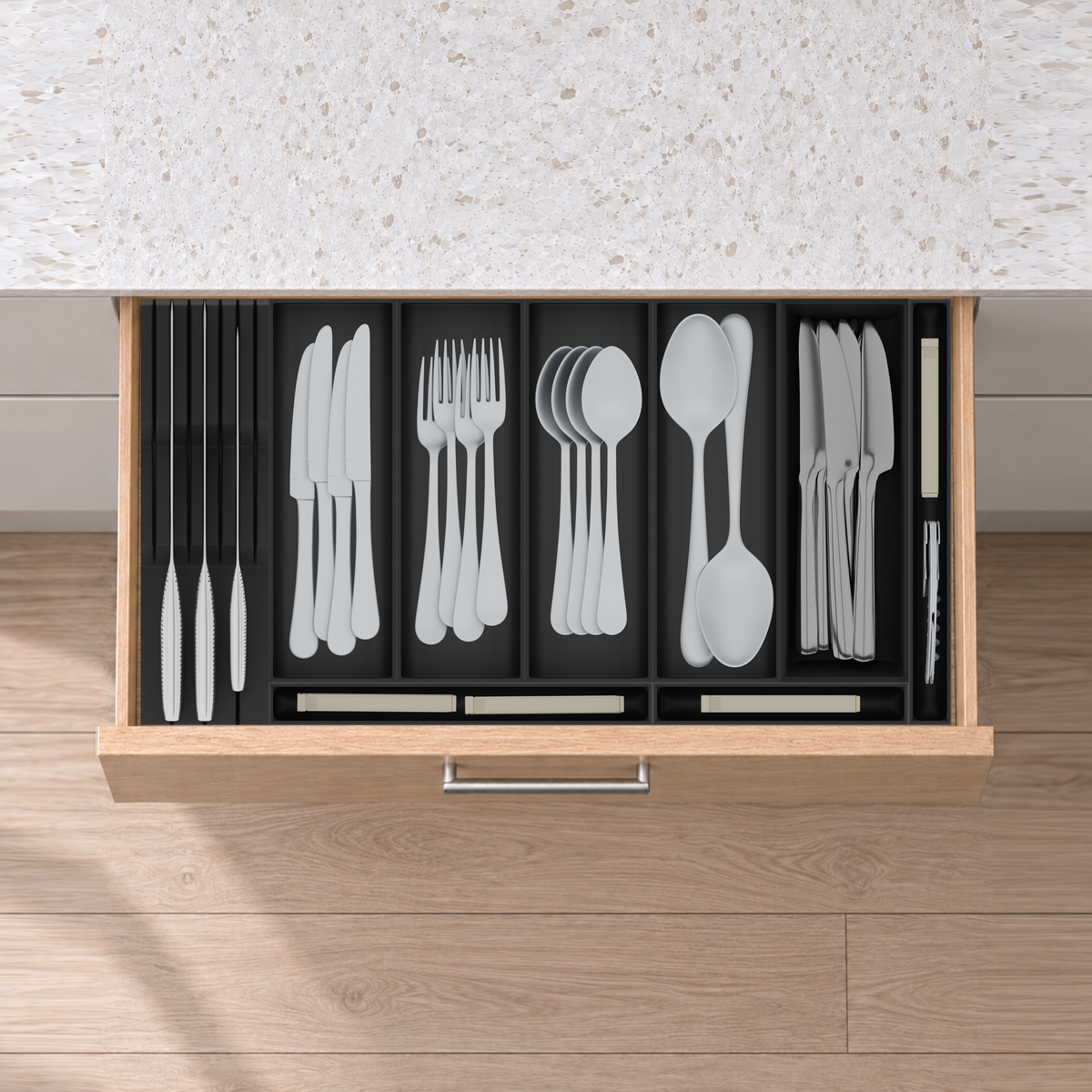 Shallow Family Cutlery & Knife Drawer Organiser Set – 560.5 × 295 mm in Charcoal Black, fitted wall-to-wall in an illustrative natural oak drawer under neutral white light. Accessories shown for illustration.