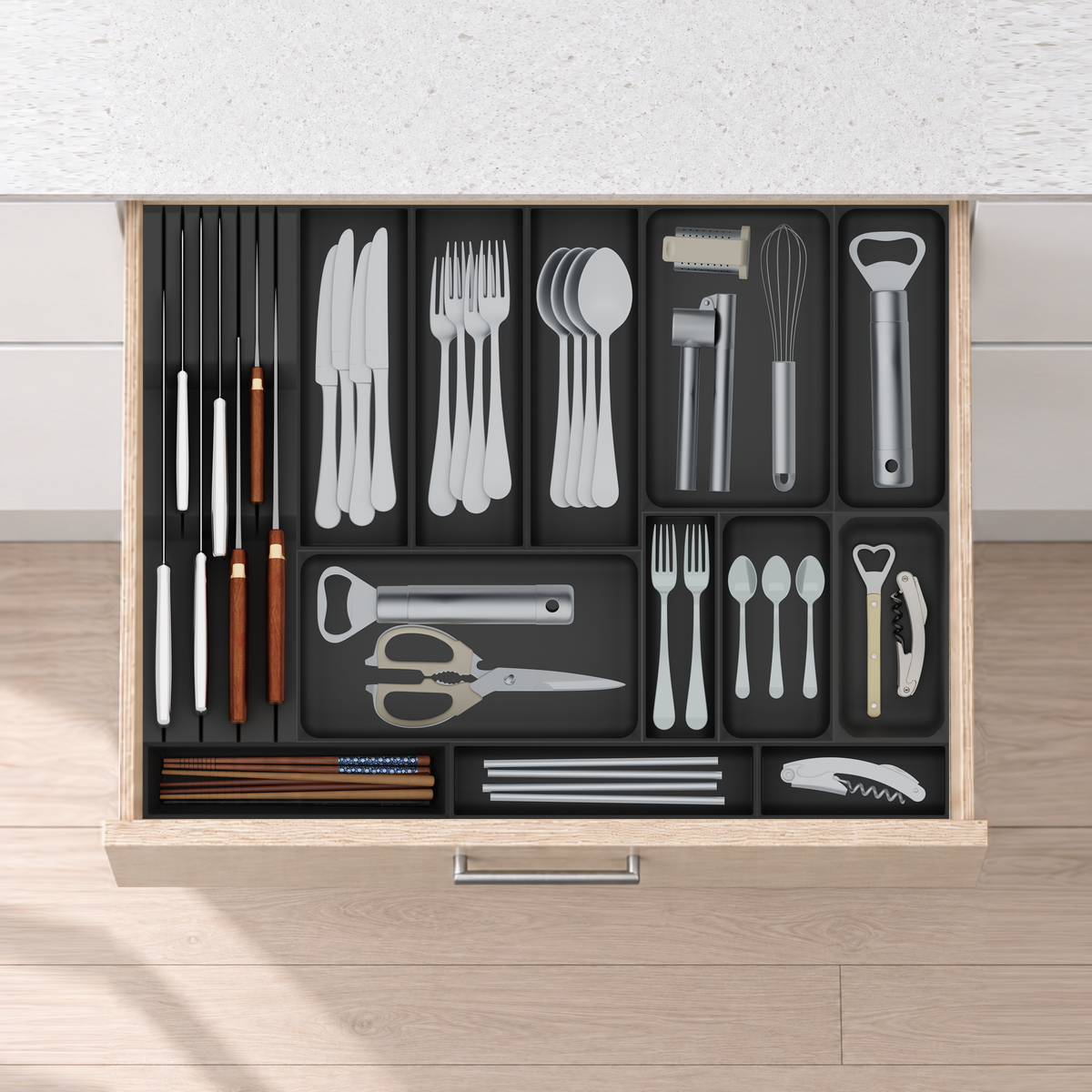 Wide Cutlery & Chef Knife Drawer Organiser Set – 619.5 × 472 mm in Charcoal Black, fitted wall-to-wall in an illustrative pale birch plywood drawer under neutral white light. Accessories shown for illustration.