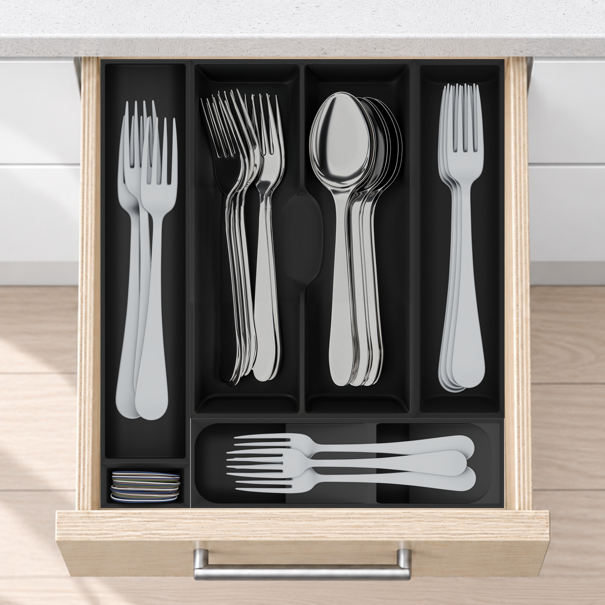 Space-Saving Cutlery Organiser – 295×265.5mm in Charcoal Black, fitted wall-to-wall in an illustrative pale birch plywood drawer under neutral white light. Accessories shown for illustration.