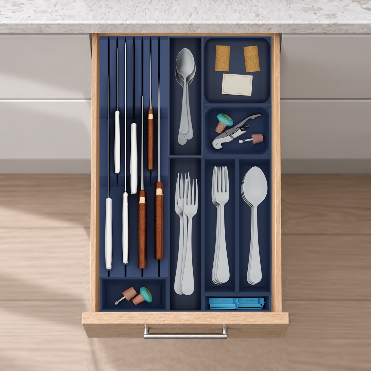Slim Modular Cutlery & Knife Organiser – 472x295mm in Army Blue, fitted wall-to-wall in an illustrative natural oak drawer under neutral white light. Accessories shown for illustration.