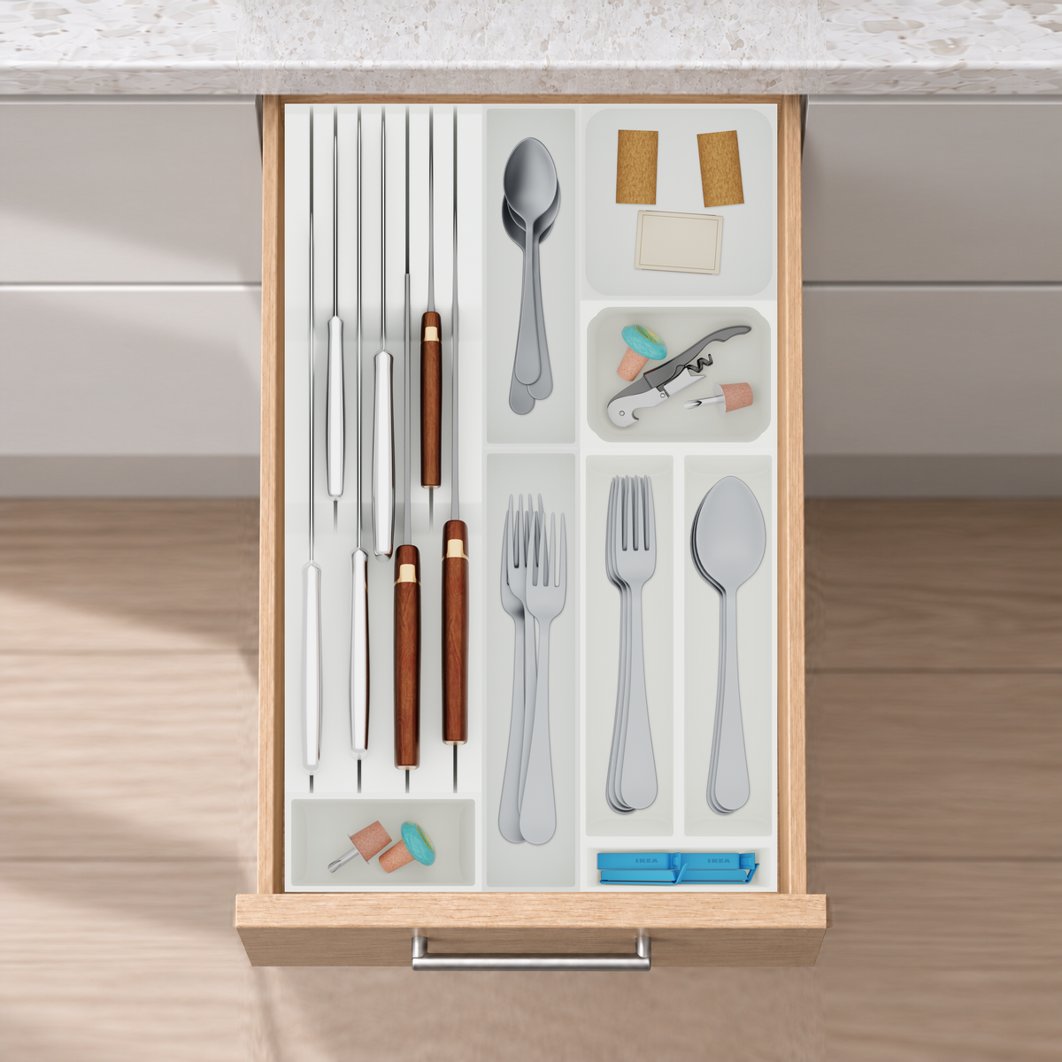 Slim Modular Cutlery & Knife Organiser – 472x295mm in Cotton White, fitted wall-to-wall in an illustrative natural oak drawer under neutral white light. Accessories shown for illustration.