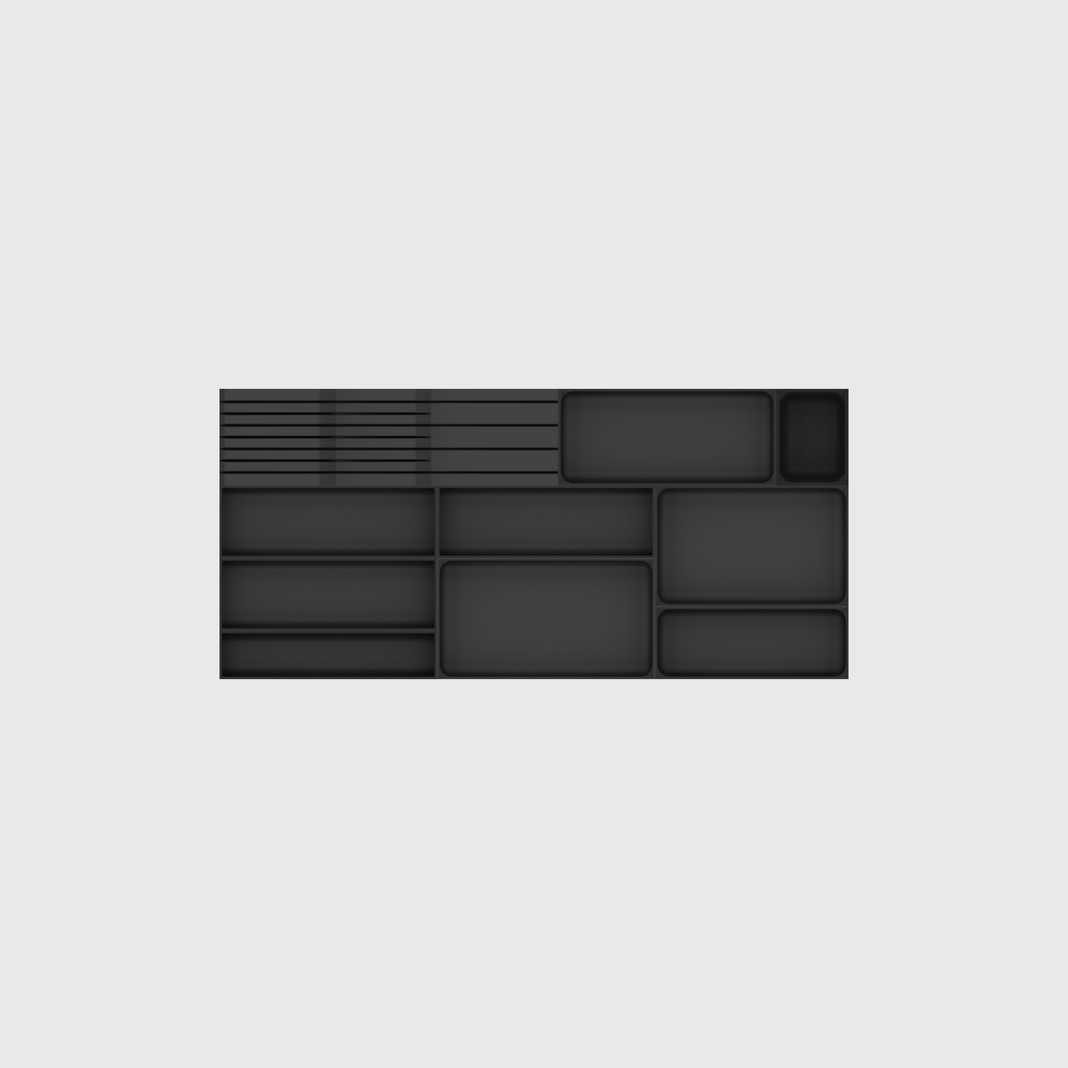 Empty module layout of the wide shallow cutlery and knife set in Charcoal Black; nominal 767 × 354 mm grid footprint.