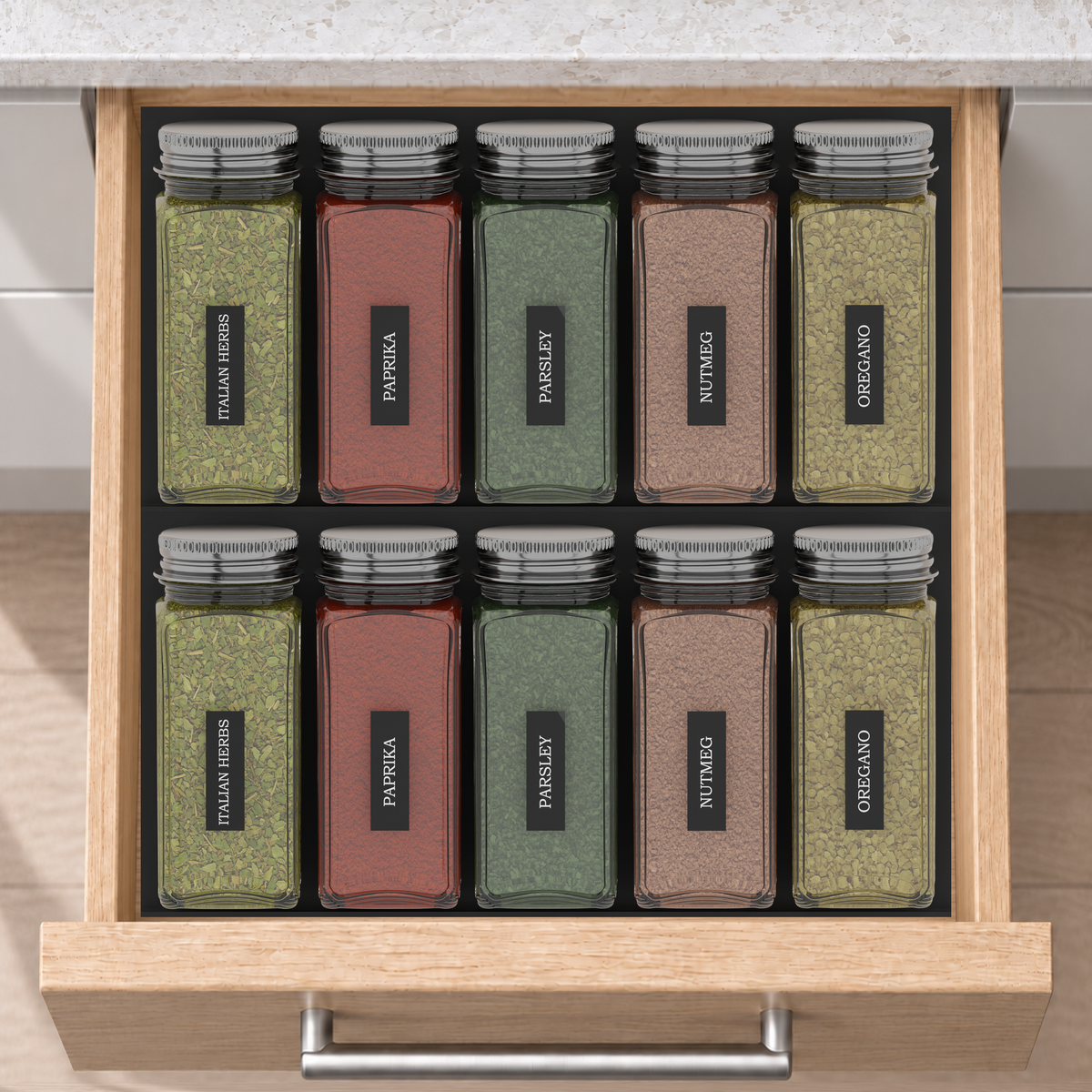 Two-Row Spice Drawer Organiser Set in Charcoal Black, fitted in an oak drawer under neutral white light. Nominal layout 236 × 236 mm. Accessories shown are not included.