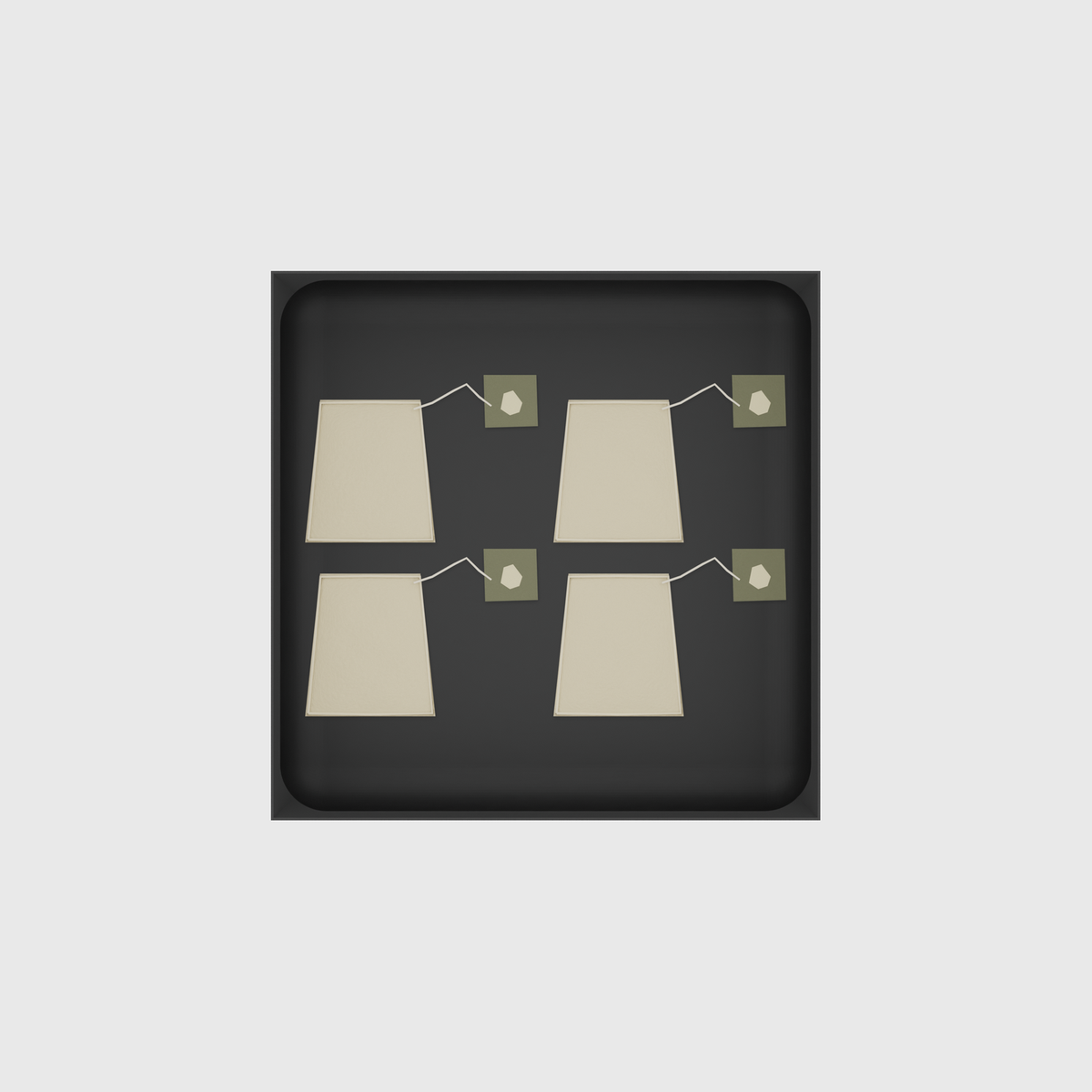 Charcoal Black stock tray with four unbranded tea bags