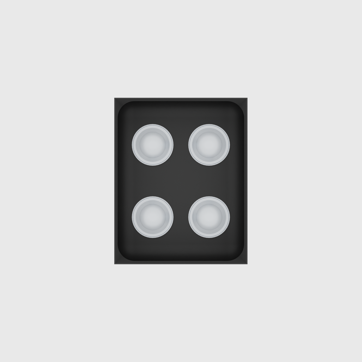 Charcoal Black stock tray with four unbranded coffee capsules