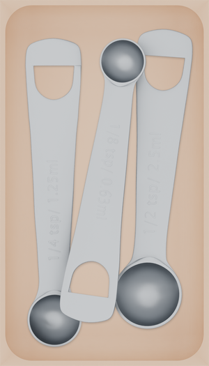 Medium tray organiser – 7×4 (206.5 × 118 mm) in Army Beige, shown with 3 measuring spoons. Top view.