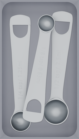Medium tray organiser – 7×4 (206.5 × 118 mm) in Fossil Grey, shown with 3 measuring spoons. Top view.