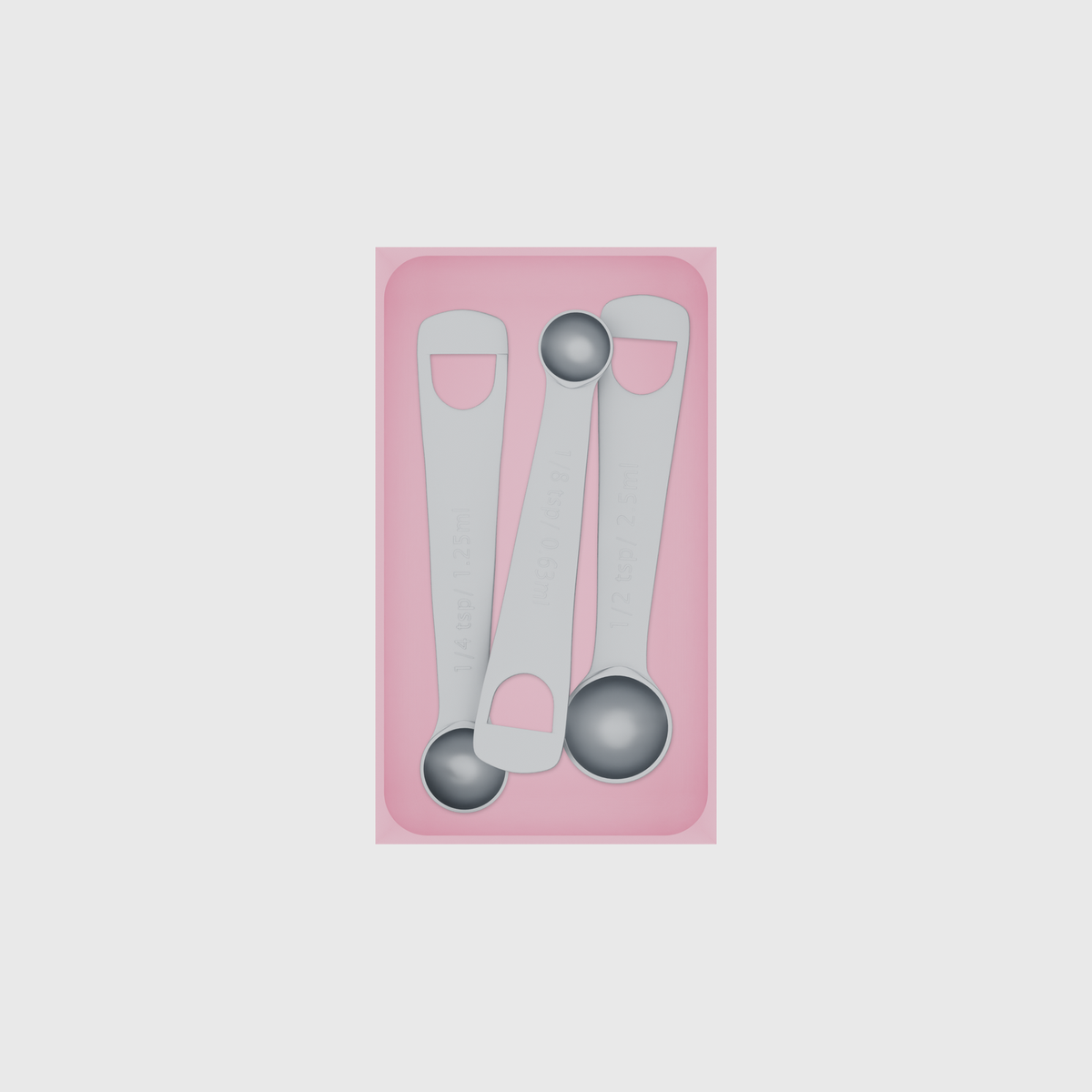 Medium tray organiser – 7×4 (206.5 × 118 mm) in Sakura Pink, shown with 3 measuring spoons. Top view.