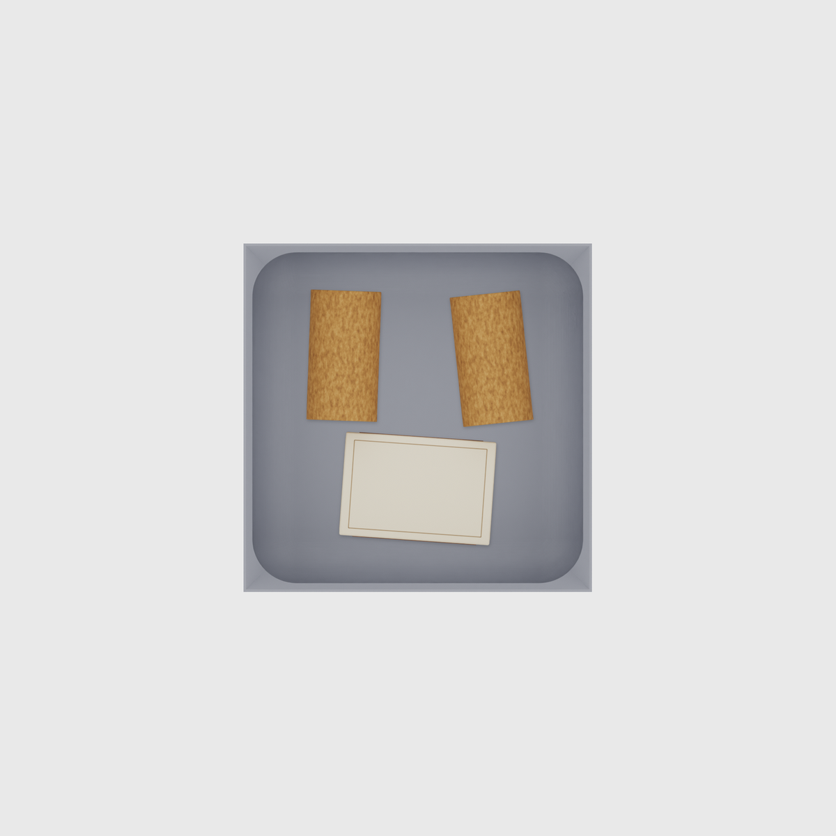 Small tray organiser – 4×4 (118 × 118 mm) in Fossil Grey, shown with a matchbox and 2 wine corks. Top view.