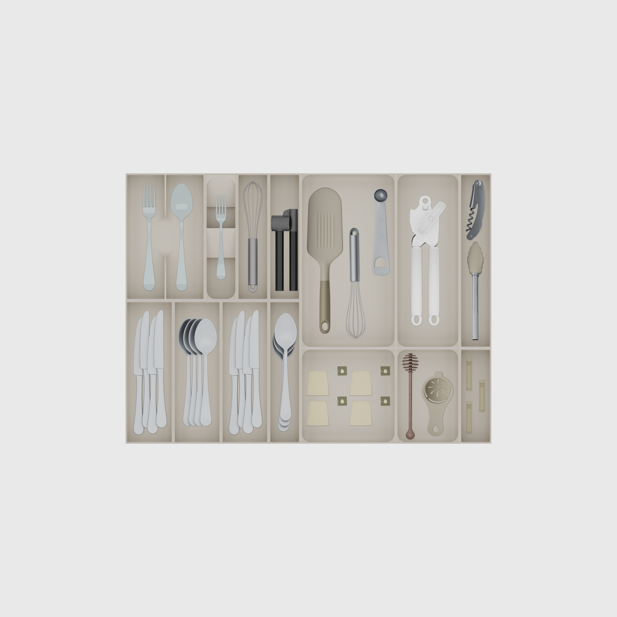 Wide Cutlery & Serving Tool Drawer Organiser Set – 678.5 × 501.5 mm in Muted White, shown with a dinner fork and a soup spoon, a dessert fork, a whisk and other small items. Top view.